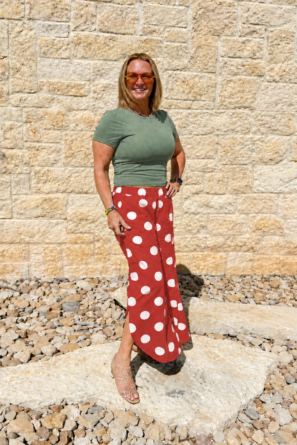 Green shirt with brighter red and white polka dot bottoms